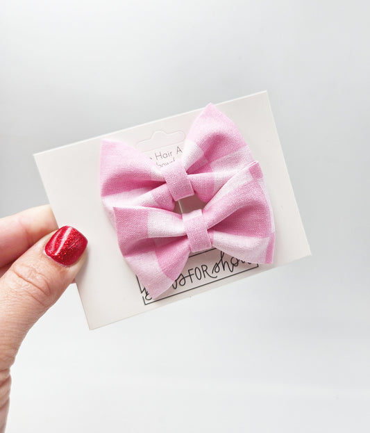 Pink checker pigtail bows