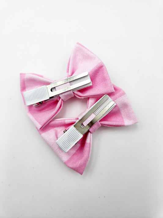 Pink checker pigtail bows