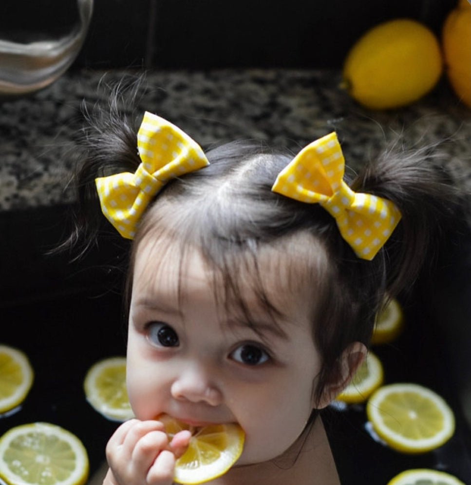 Yellow and white checkered pigtail hair bows